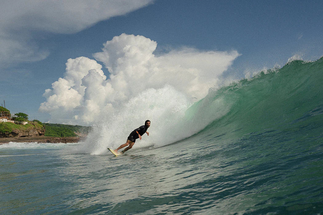 Christian Ramirez surfing in a UV long sleeve shirt