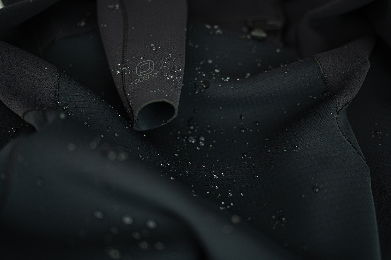 Ocena logo visible on a close up of a wetsuit
